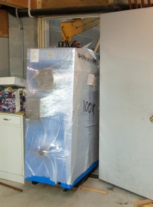 Boiler just barely fits through the door, with the beam attached.